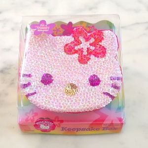 NWT. Hello Kitty's face shape Keepsake box with multi color sparkling design.